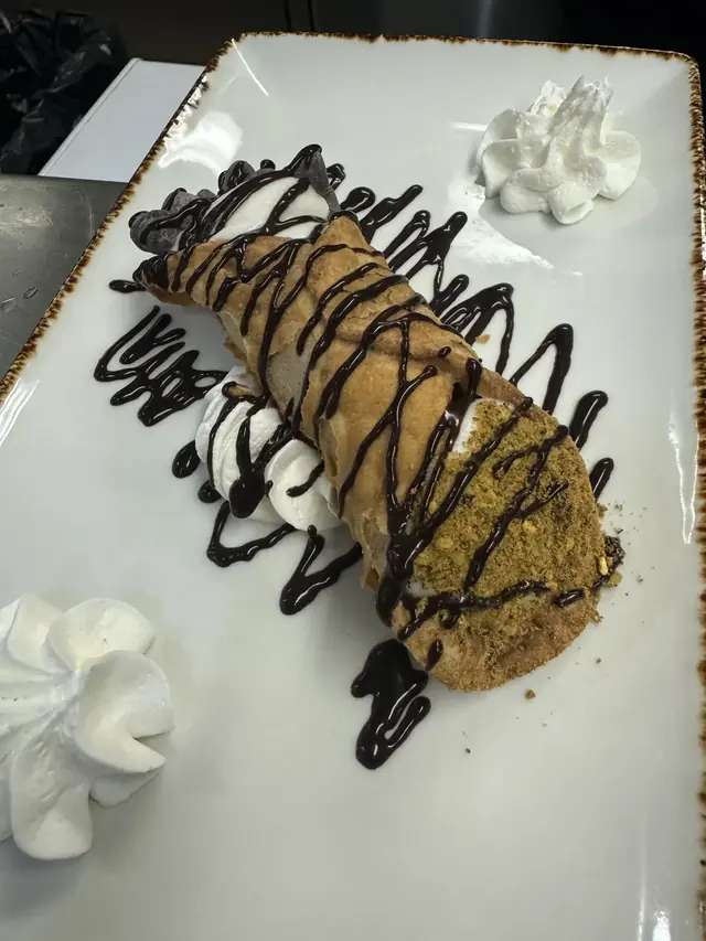 Plated dessert with chocolate drizzle